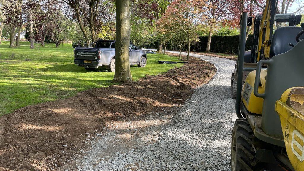 diggers laying gravel