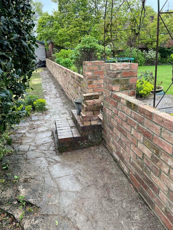 entrance with brick wall